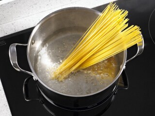 Noodles in a stainless steel pot