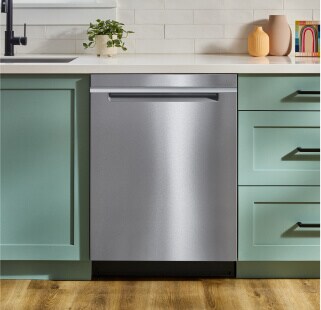 A Whirlpool® Dishwasher and teal cabinetry