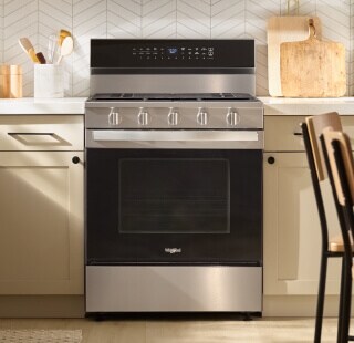 A Whirlpool® Range and white cabinetry