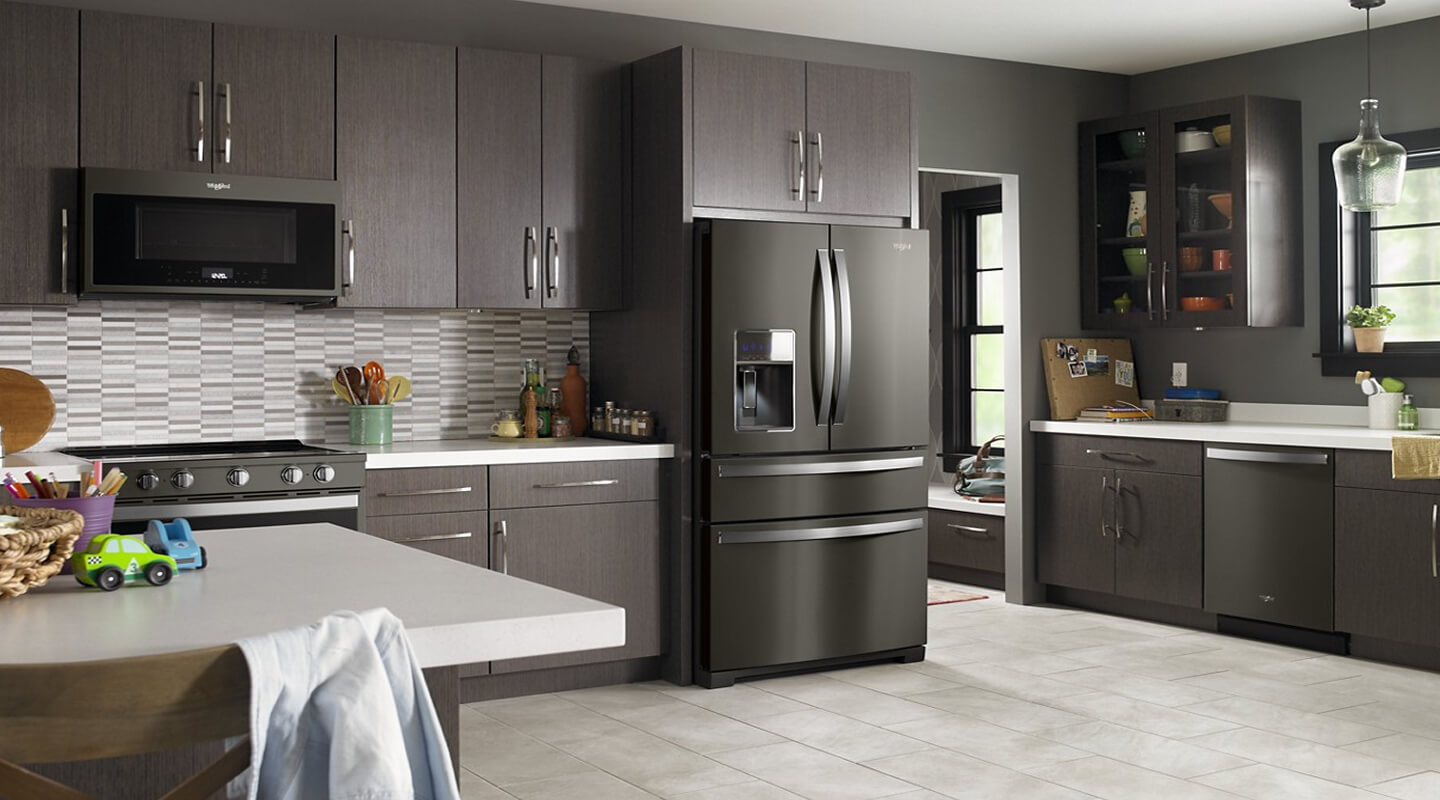 Black Stainless Whirlpool® 4-Door Refrigerator in dark brown cabinetry