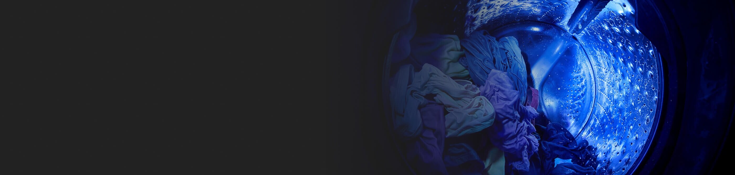 Inside a Whirlpool®  Washer basket with UV Clean Technology shining a blue UV light