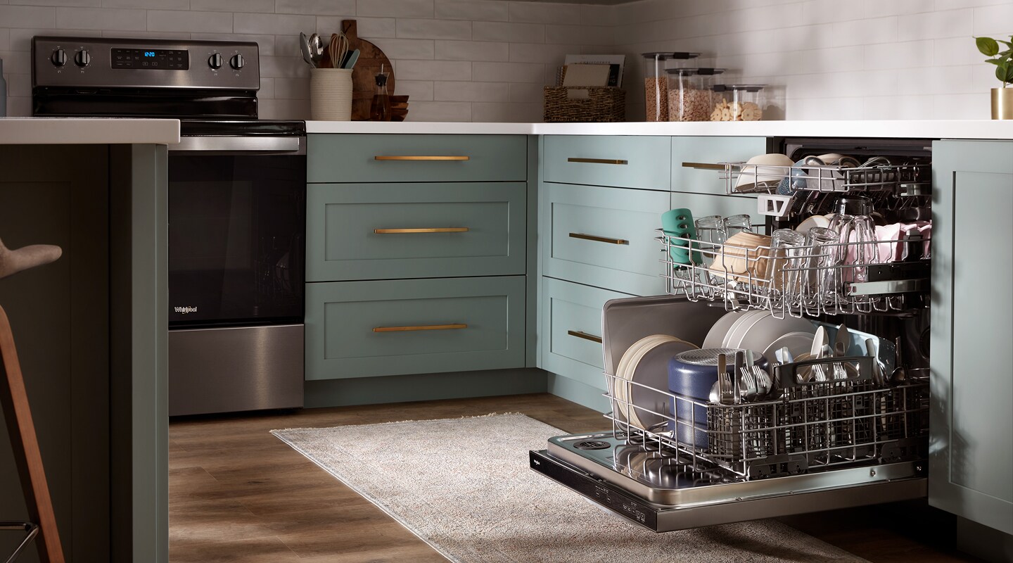 Open dishwasher filled with dishes in a modern kitchen