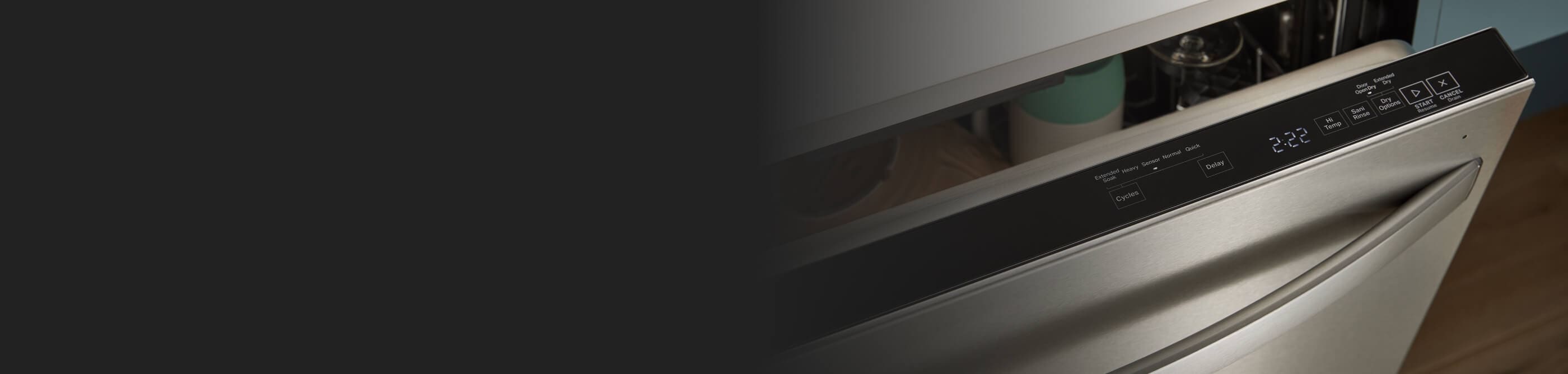 Top control dishwasher open to show control panel