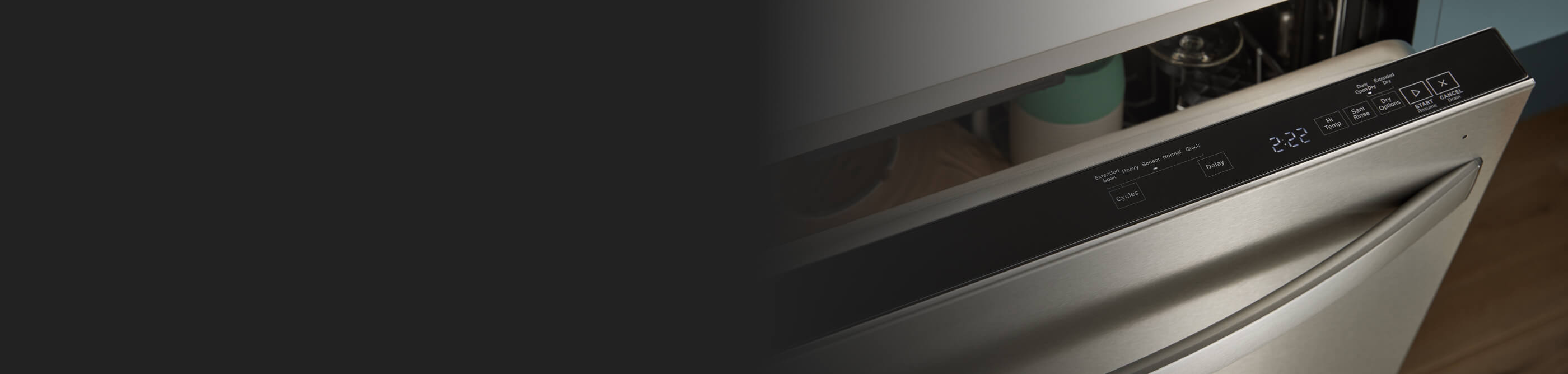 Top control dishwasher open to show control panel