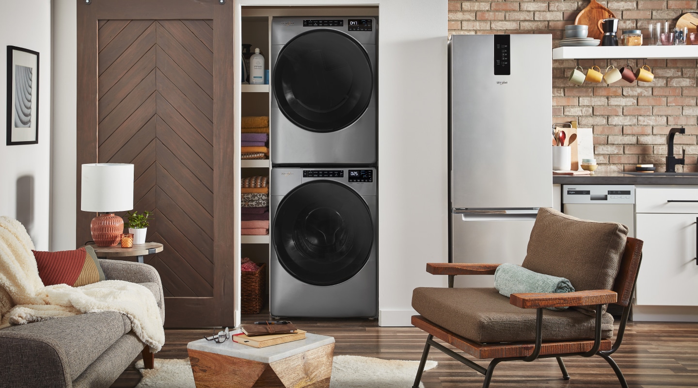 Whirlpool® stackable washer and dryer inside a closet Whirlpool® stackable washer and dryer inside a closet