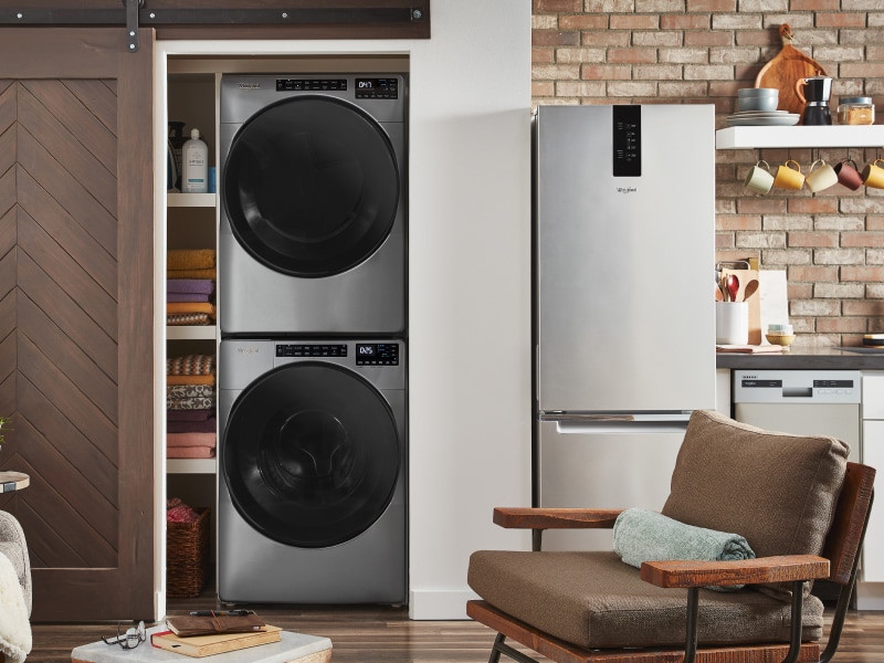 Whirlpool® stackable washer and dryer inside a closet Whirlpool® stackable washer and dryer inside a closet