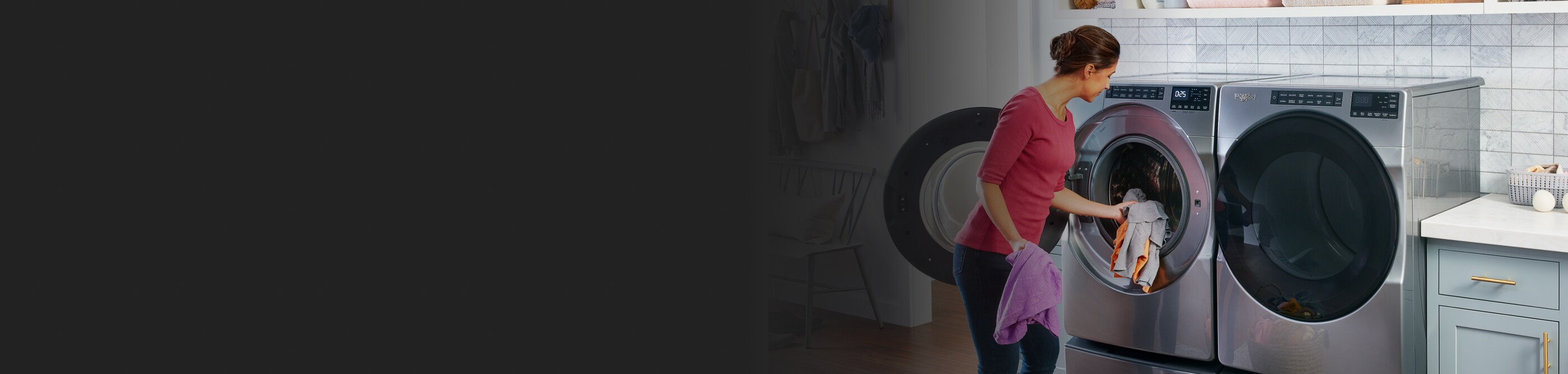 Person loading items into a front load washing machine