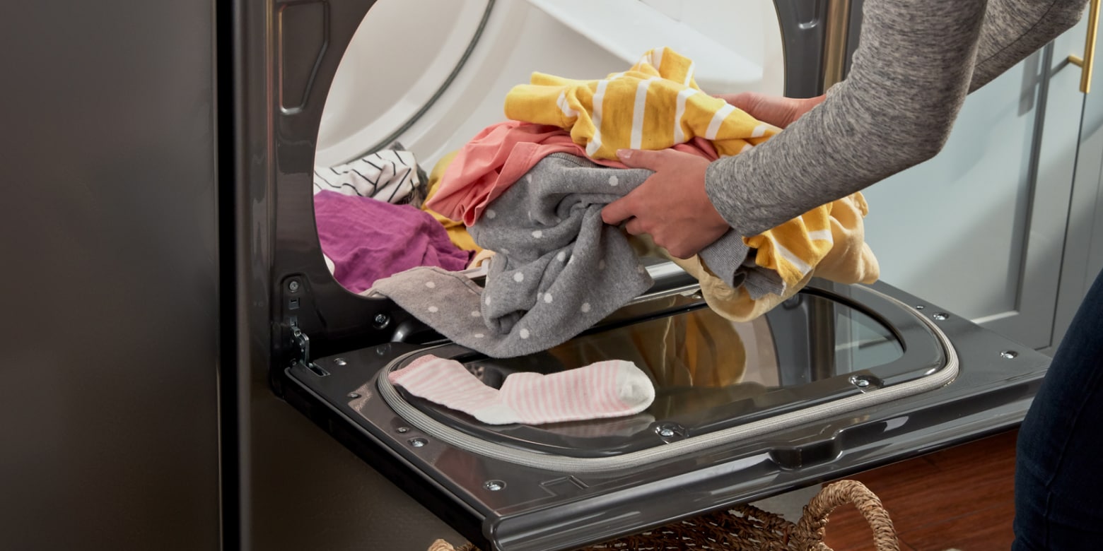 Person taking laundry out of dryer