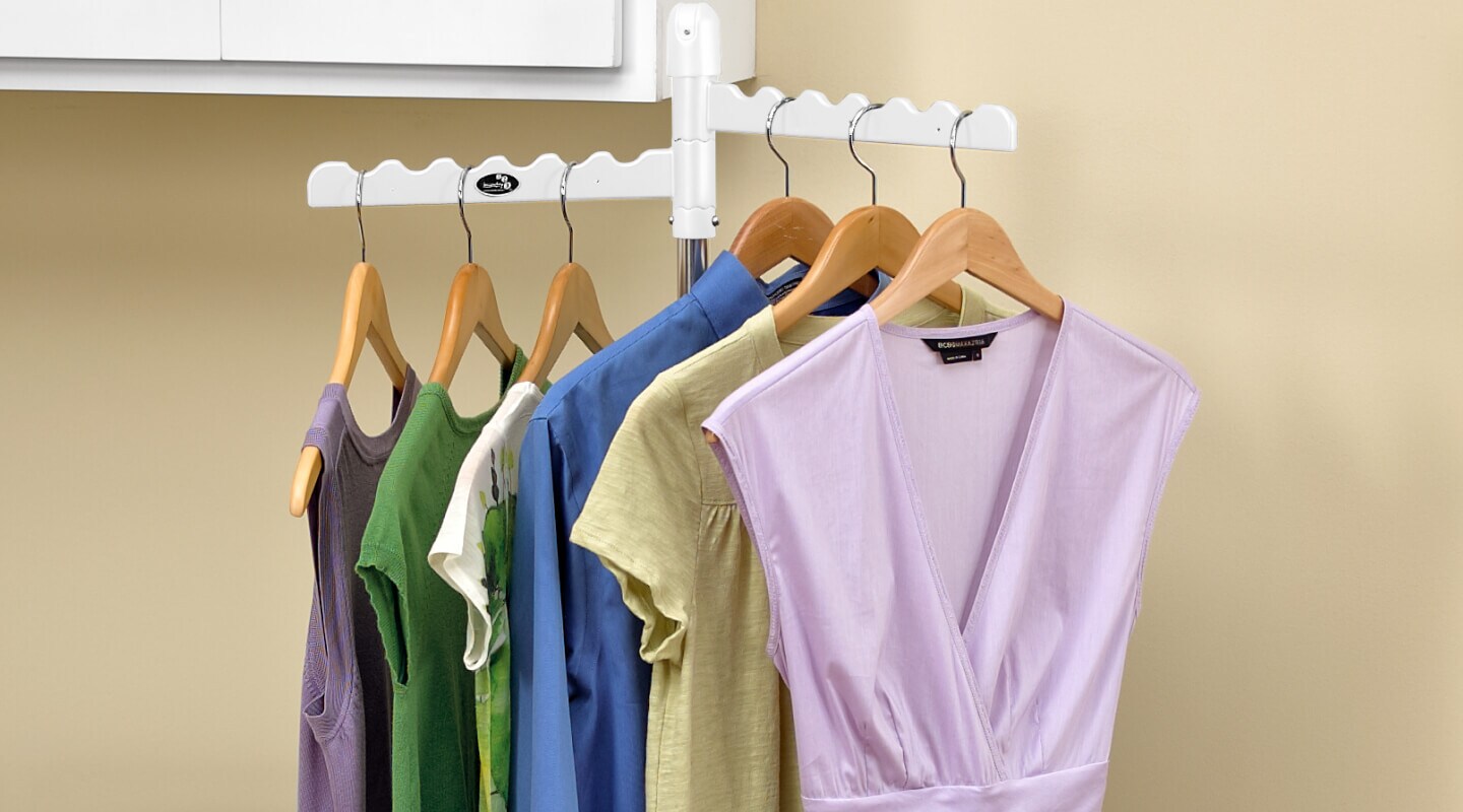 Clothing on hangers on a drying rack Clothing on hangers on a drying rack