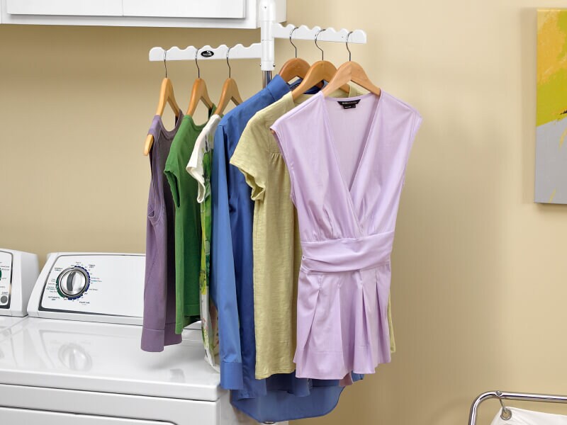 Clothing on hangers on a drying rack Clothing on hangers on a drying rack
