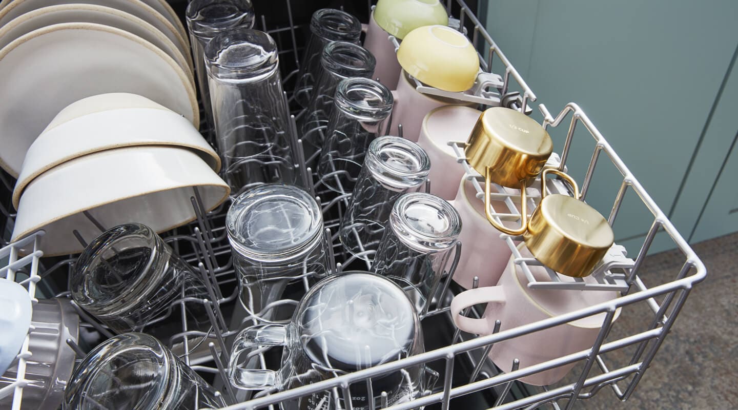 Clean and dried dishes in a dishwasher Clean and dried dishes in a dishwasher