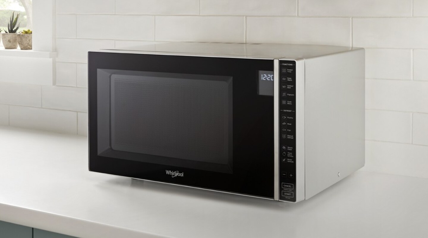 Whirlpool® countertop microwave in front of white backsplash Whirlpool® Countertop Microwave in front of white backsplash