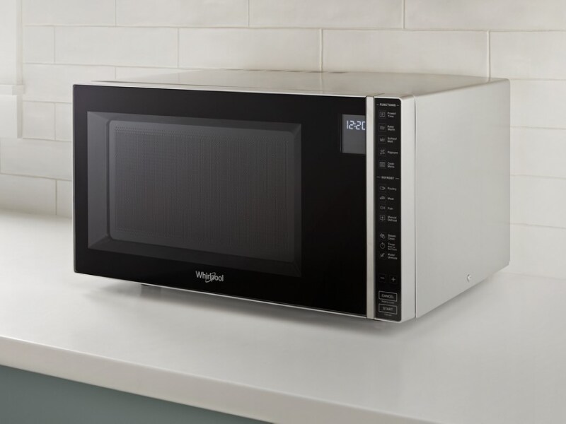 Whirlpool® Countertop Microwave in front of white backsplash Whirlpool® Countertop Microwave in front of white backsplash