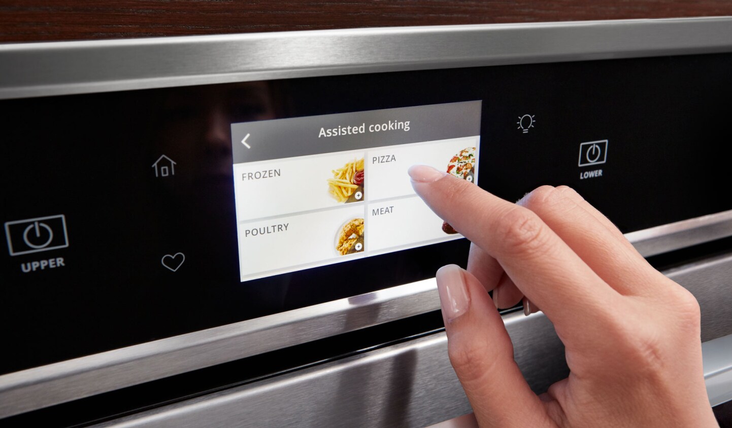 Person making a selection on a smart oven