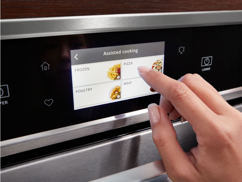 Person making a selection on a smart oven