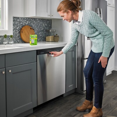 Person starting wash cycle