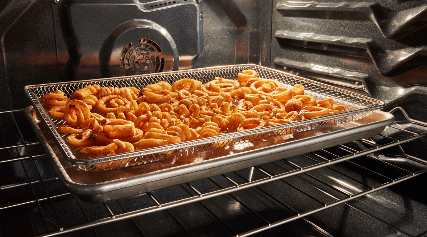 Curly fries in an oven