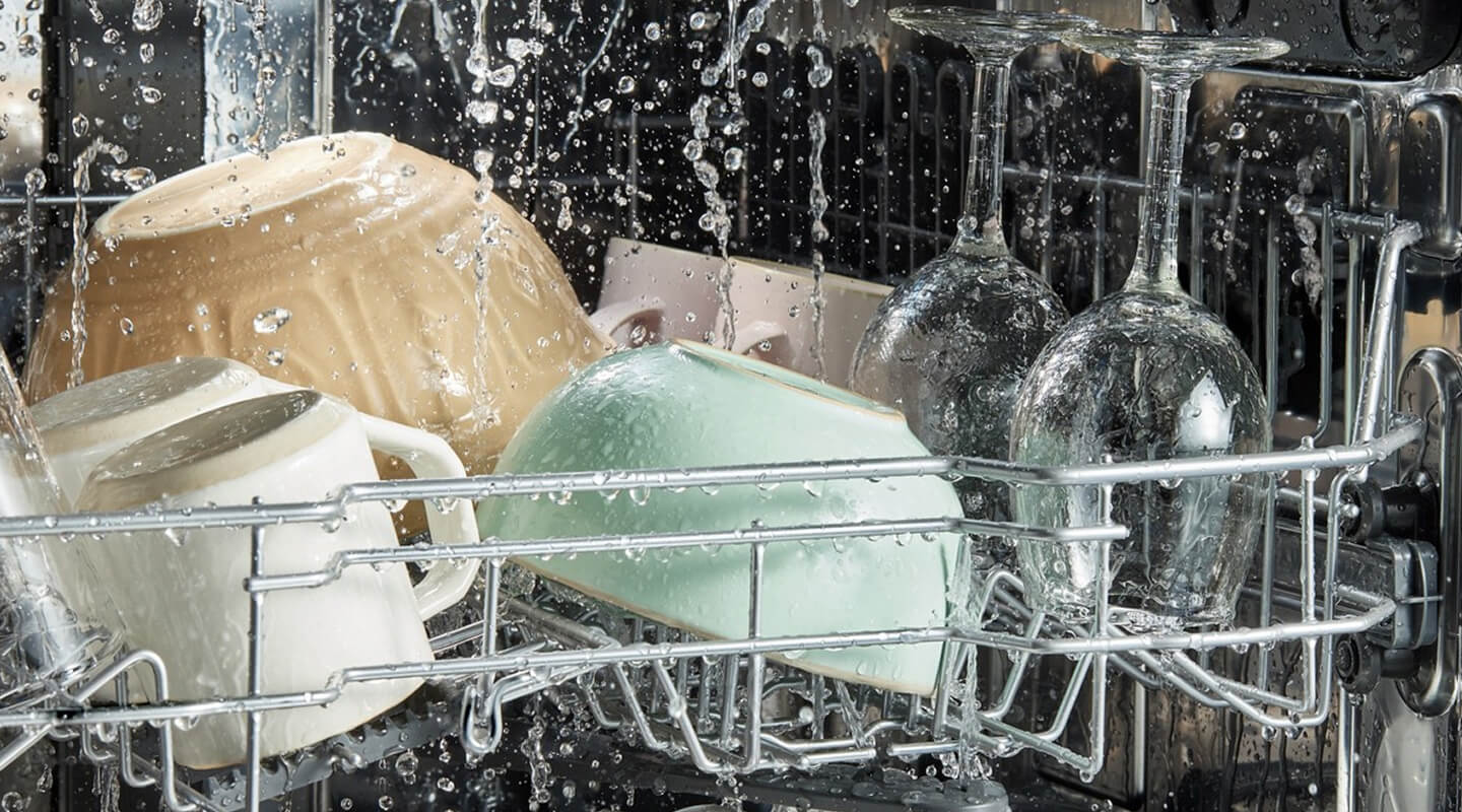 Dishes getting washed in a Whirlpool® Dishwasher