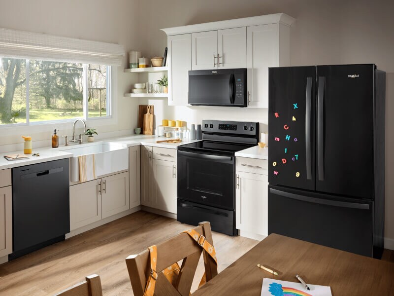 Black kitchen appliances in a bright kitchen Black kitchen appliances in a bright kitchen