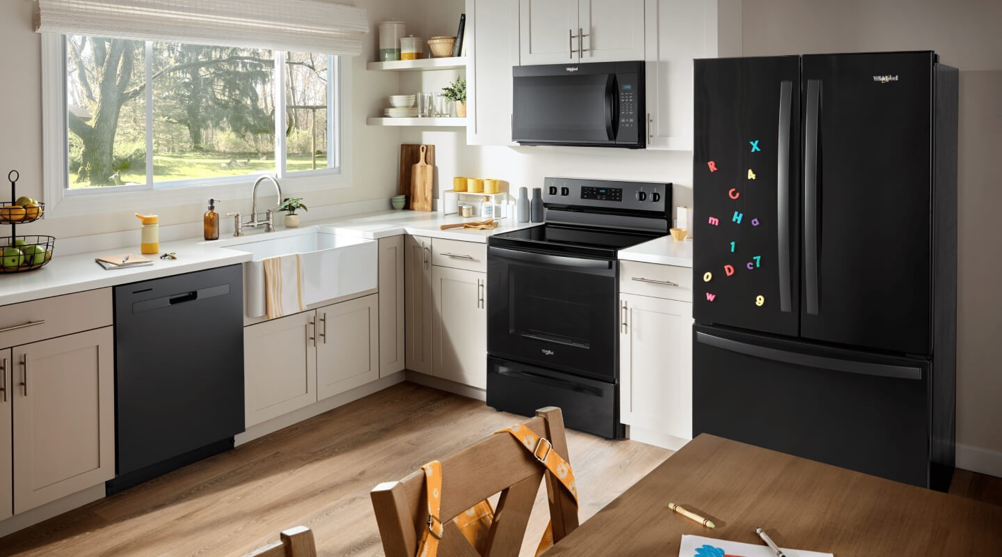 Black kitchen appliances in a bright kitchen Black kitchen appliances in a bright kitchen