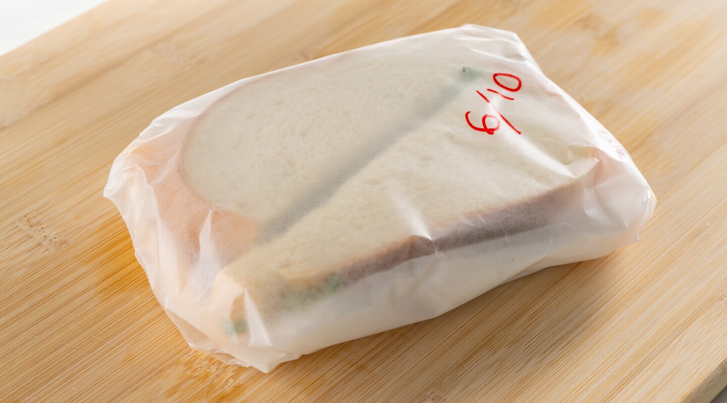 Sandwich wrapped with wax paper Sandwich wrapped with wax paper