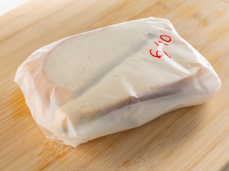 Sandwich wrapped with wax paper Sandwich wrapped with wax paper