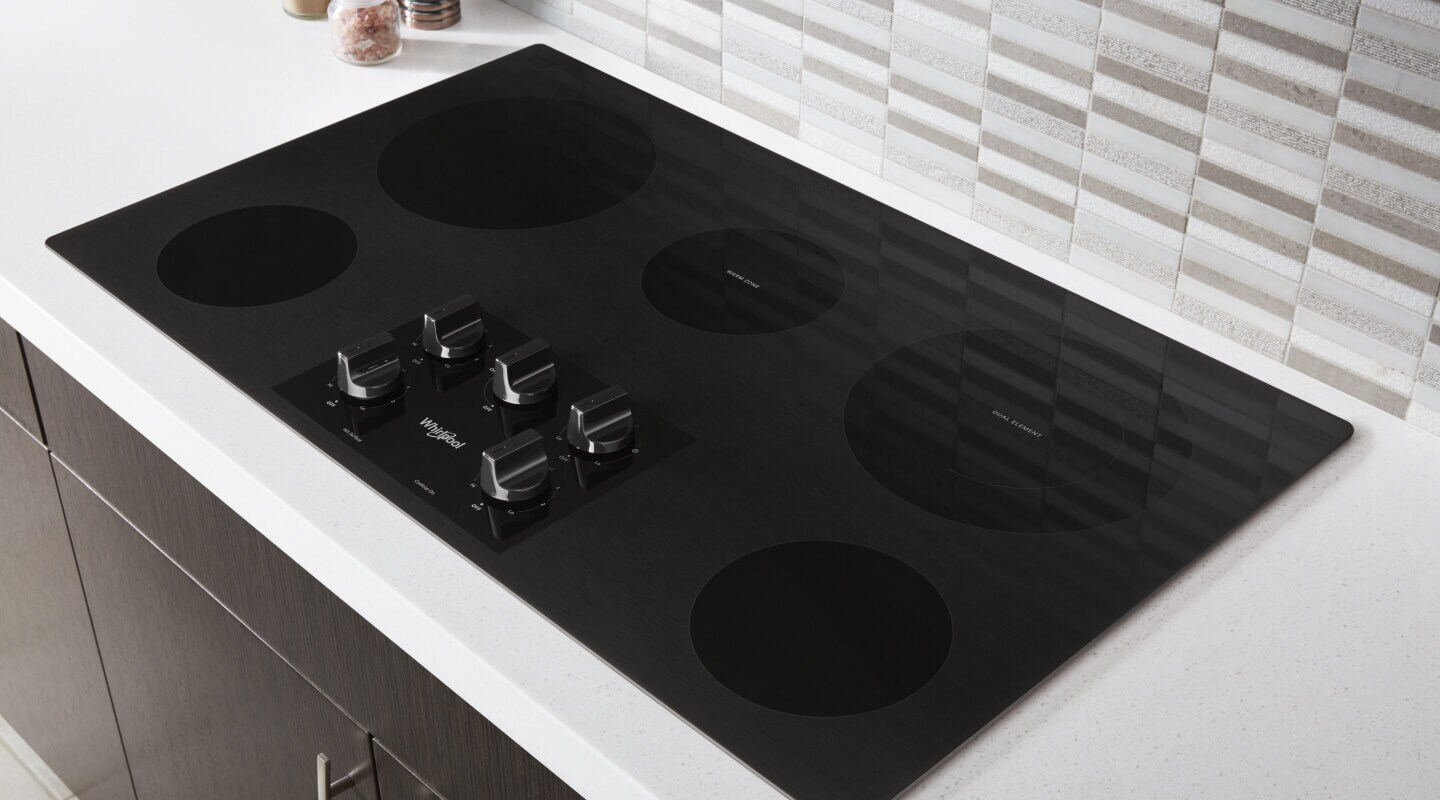 A black Whirlpool® Electric Cooktop