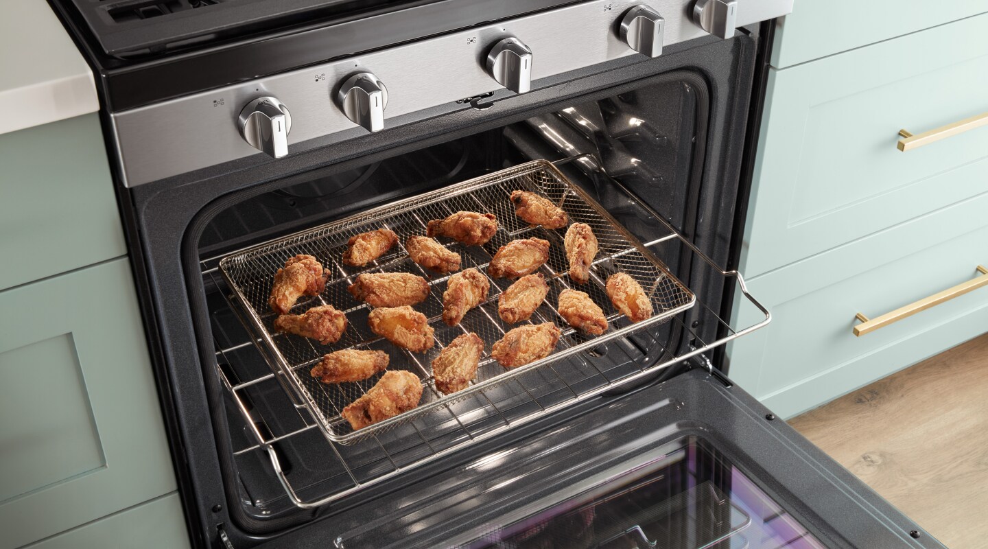 Chicken wings in an air fry basket Chicken wings in an air fry basket