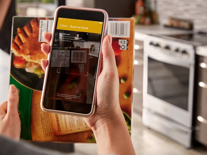 Person using the Whirlpool® App Person using the Whirlpool® App