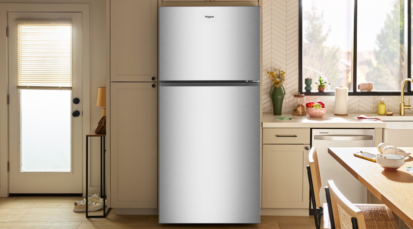 Whirlpool® Top Freezer refrigerator in a neutral kitchen