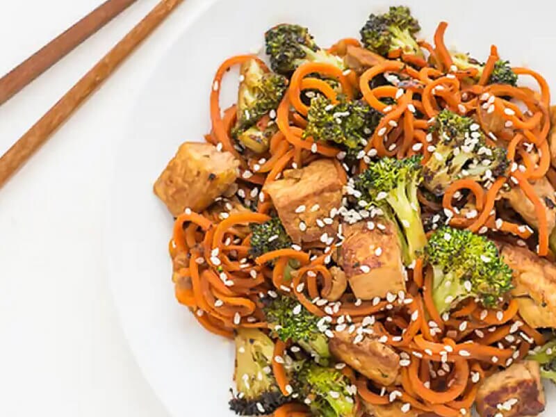 Spiralized Sesame Carrot Tofu Stir Fry with chopsticks Spiralized Sesame Carrot Tofu Stir Fry with chopsticks