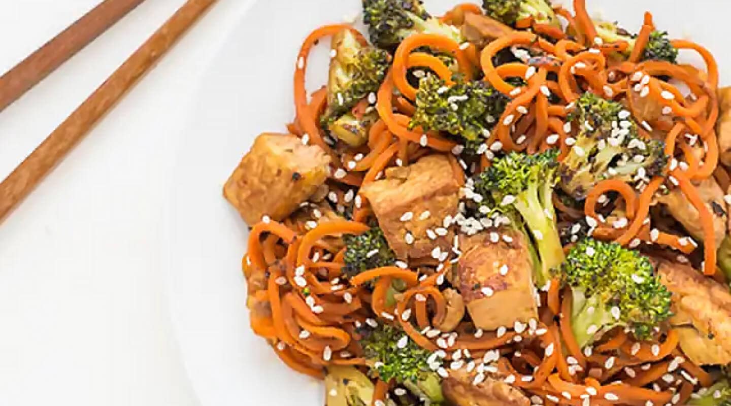 Spiralized Sesame Carrot Tofu Stir Fry with chopsticks Spiralized Sesame Carrot Tofu Stir Fry with chopsticks