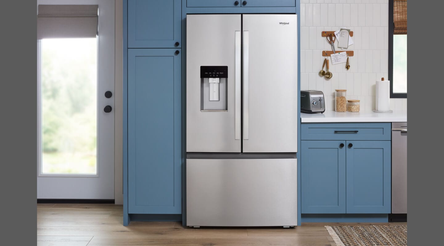 Whirlpool® French door refrigerator in blue cabinetry