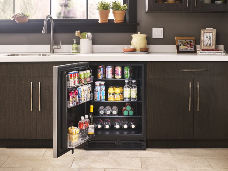 Undercounter refrigerator in brown cabinetry