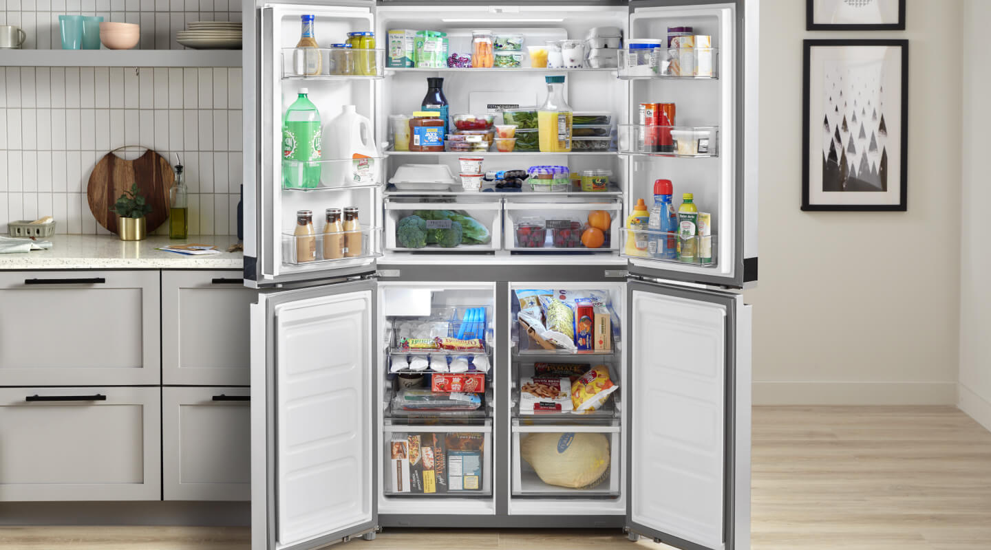 Refrigerator with doors open to show contents