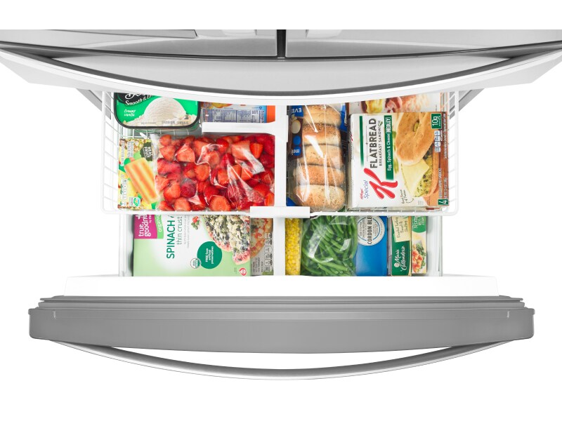 An open fridge freezer compartment An open fridge freezer compartment