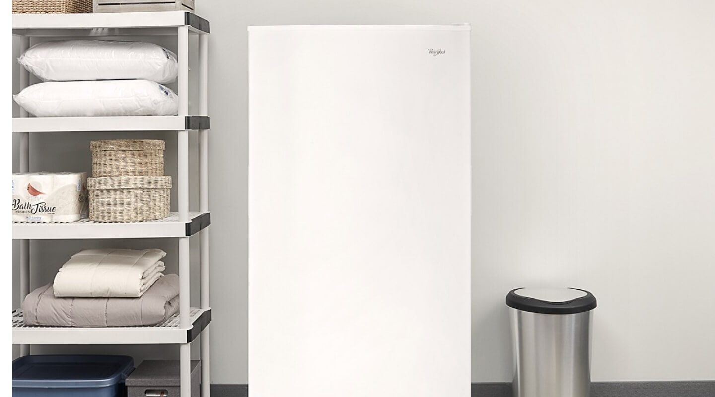 White Whirlpool® Upright Freezer along garage wall White Whirlpool® Upright Freezer along garage wall