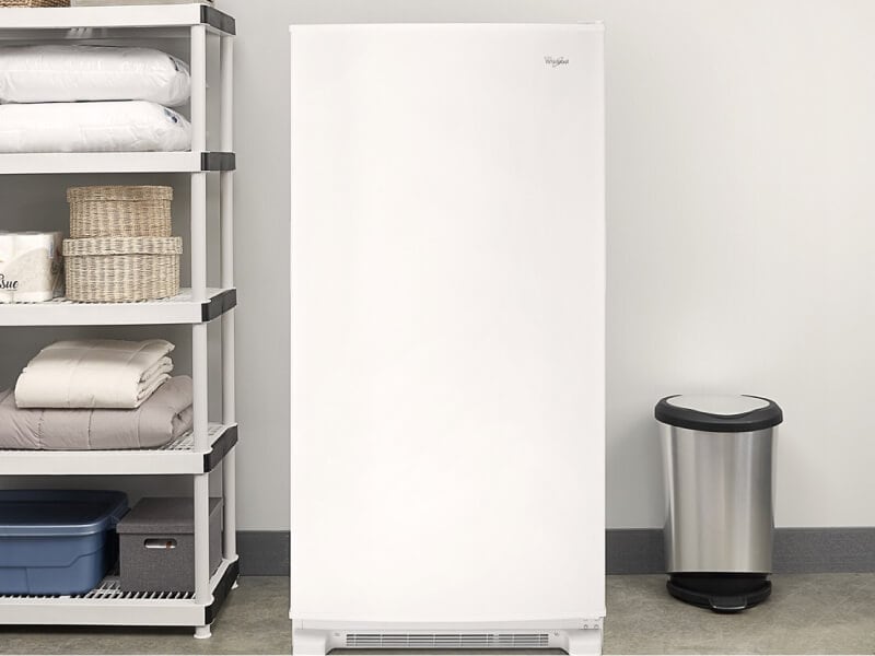 White Whirlpool® Upright Freezer along garage wall White Whirlpool® Upright Freezer along garage wall