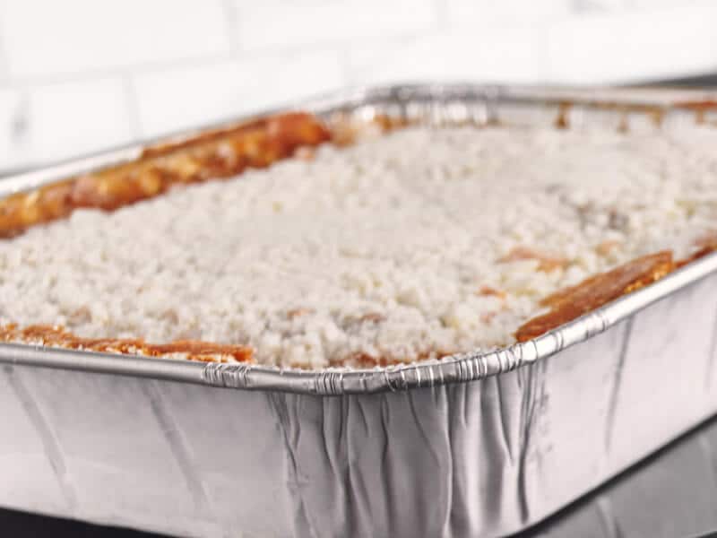 Lasagna in a foil pan getting ready to cook in the oven Lasagna in a foil pan getting ready to cook in the oven