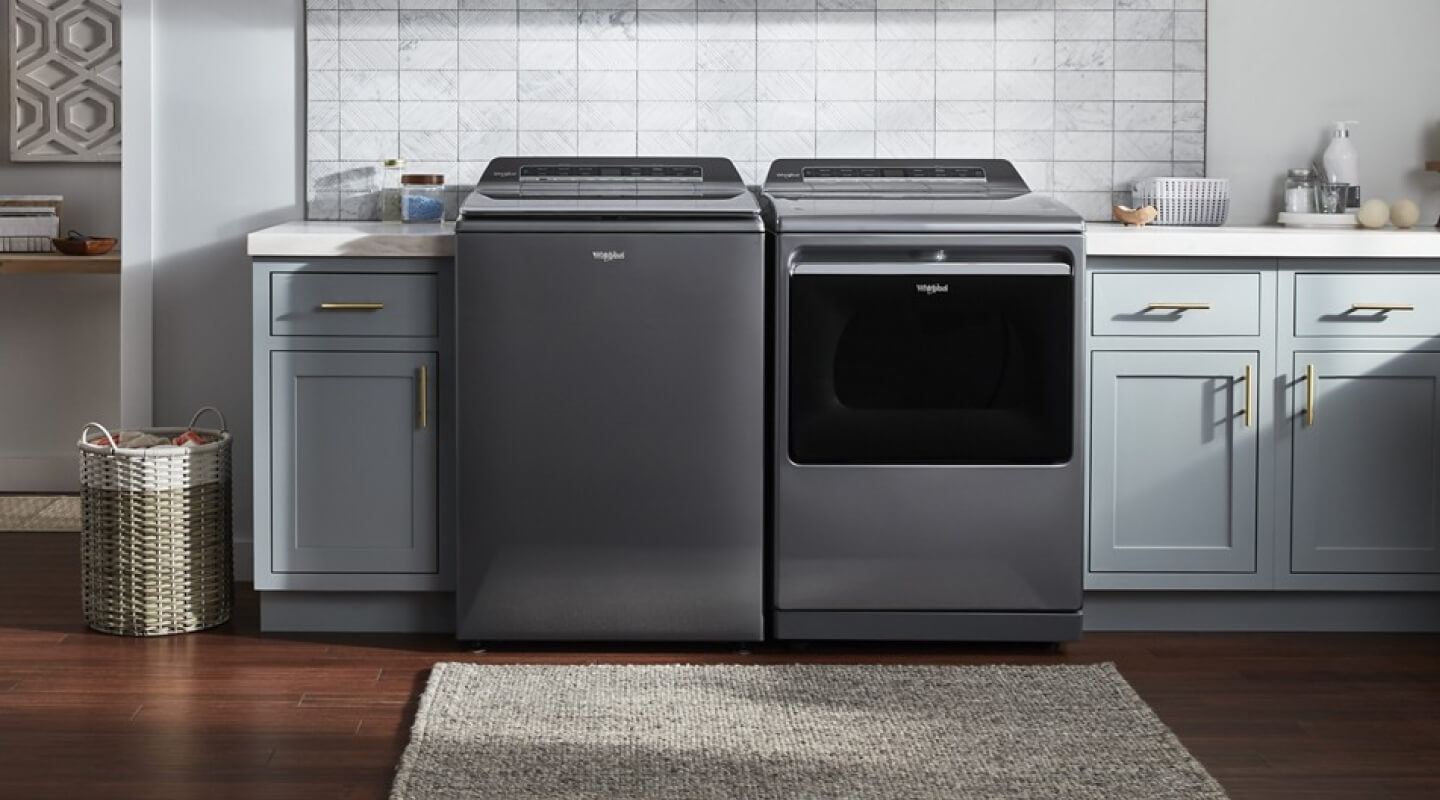 A Whirlpool® Washer and Dryer set in a modern laundry room