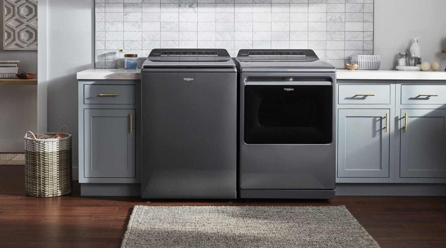 A Whirlpool® Washer and Dryer set in a modern laundry room
