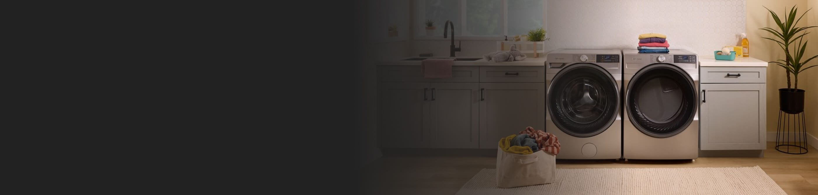 A Whirlpool® Washer and Dryer set in a modern laundry room