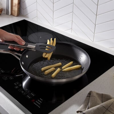 A non-stick pan on a Whirlpool® Cooktop