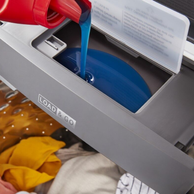 Detergent pouring into dispenser