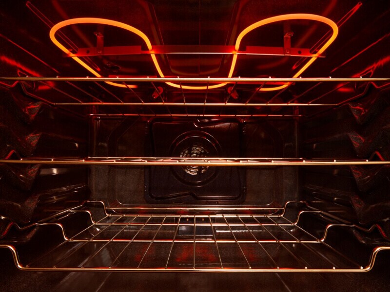 The inside of an oven with three racks The inside of an oven with three racks