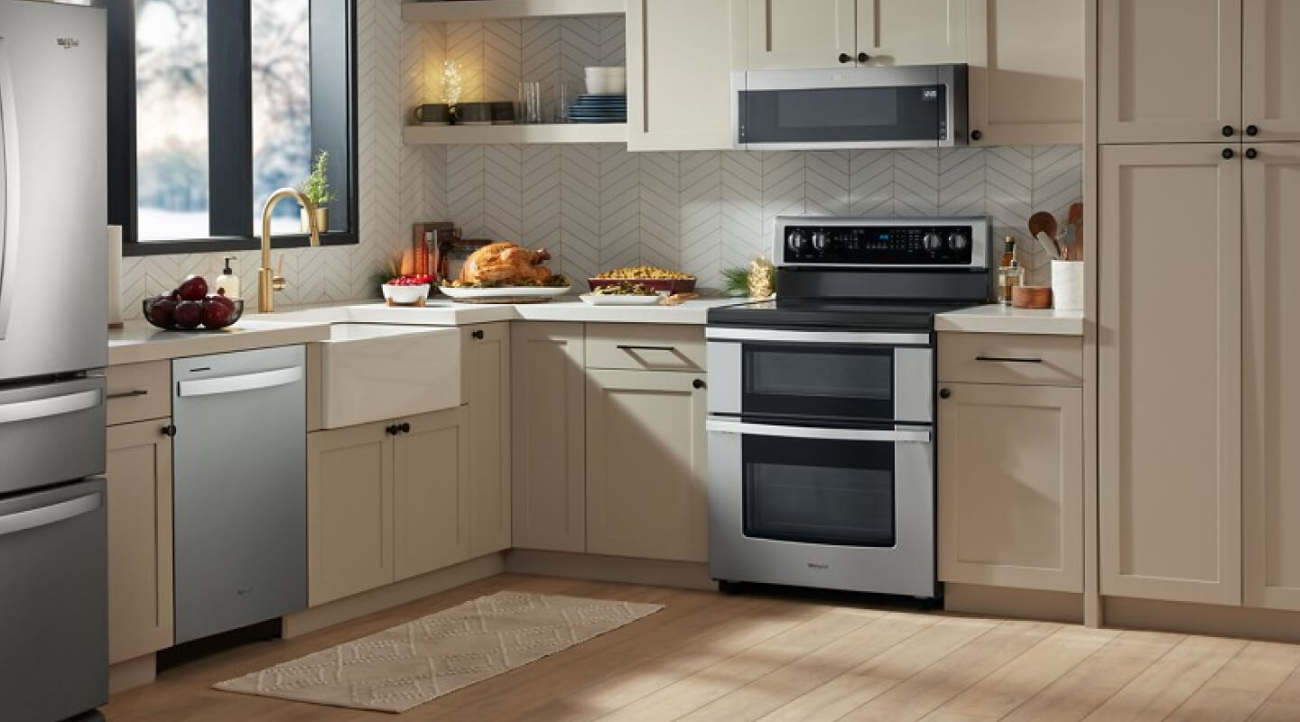 A full suite of Whirlpool® Appliances in an open kitchen
