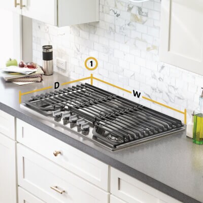 Gas cooktop set into gray countertop with dimensions for depth and width noted