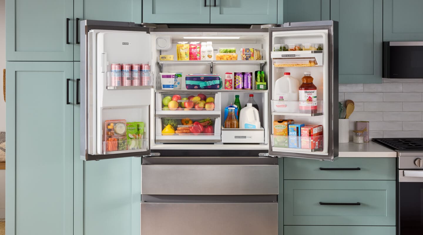 A counter-depth refrigerator shown with its top doors open
