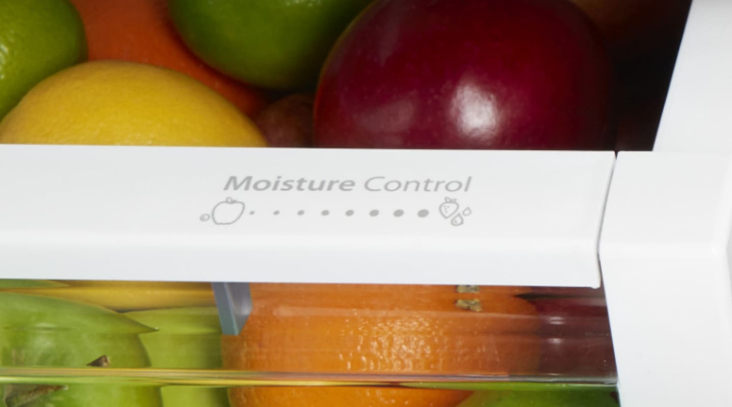 A humidity setting control on a crisper drawer A humidity setting control on a crisper drawer