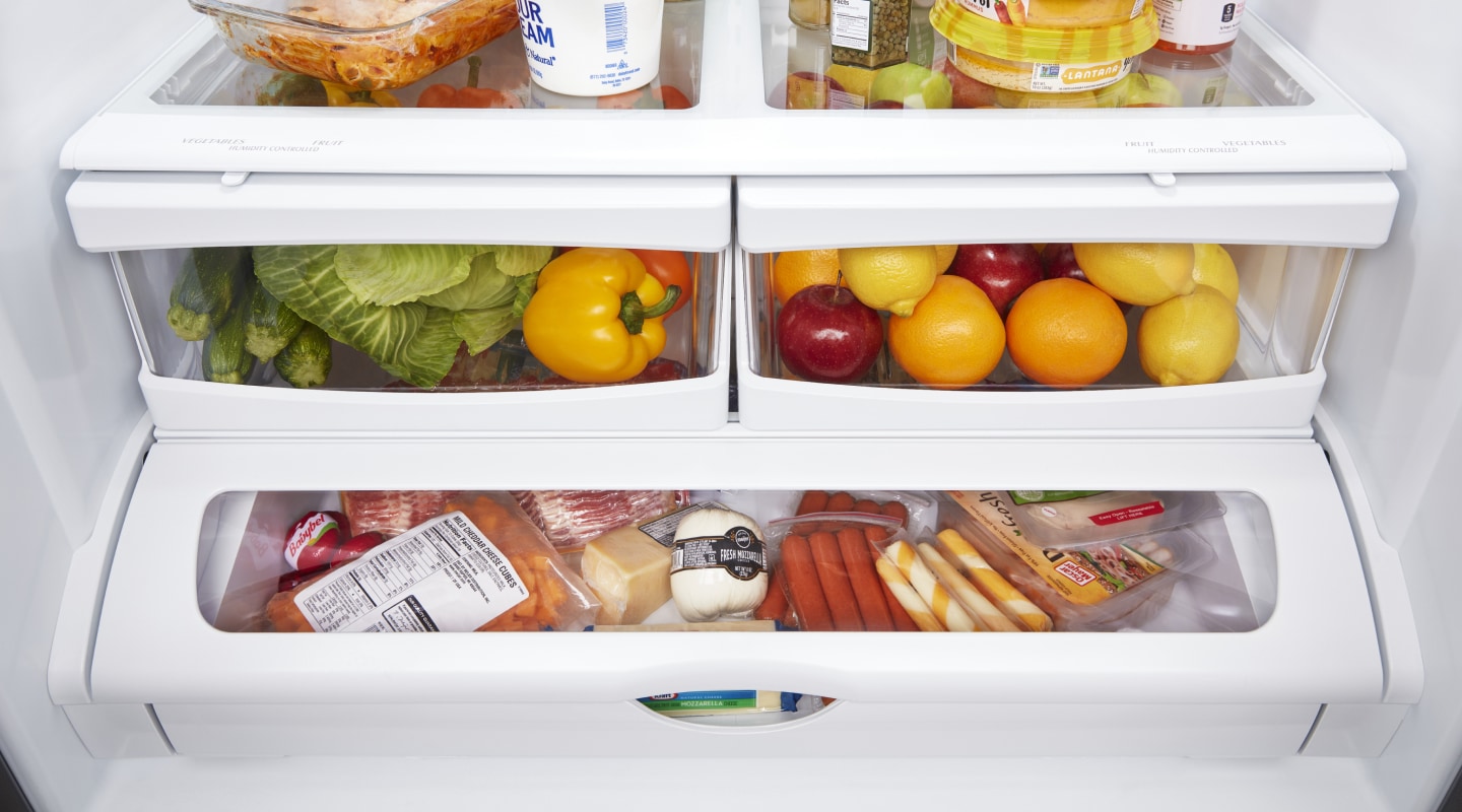 Closed crisper drawers filled with food Closed crisper drawers filled with food